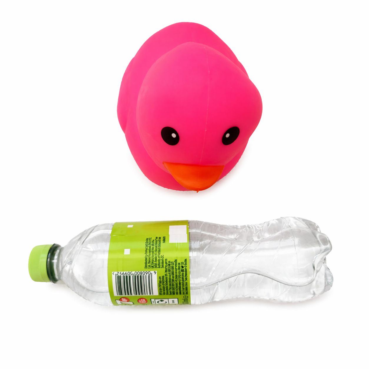 Top view of pink squishy duck with bottle showing scale and size