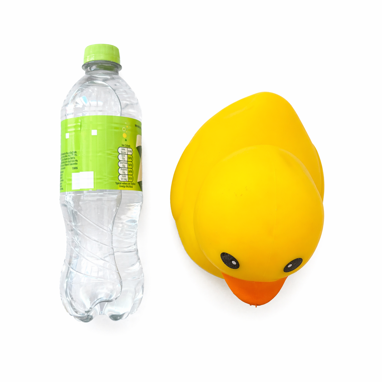 Top view of yellow squishy duck with bottle for scale reference